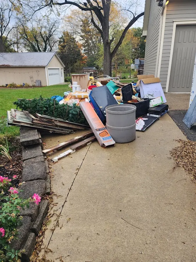 Dumpster being loaded with debris for 12 Yard Dumpster Rental in Granite Bay